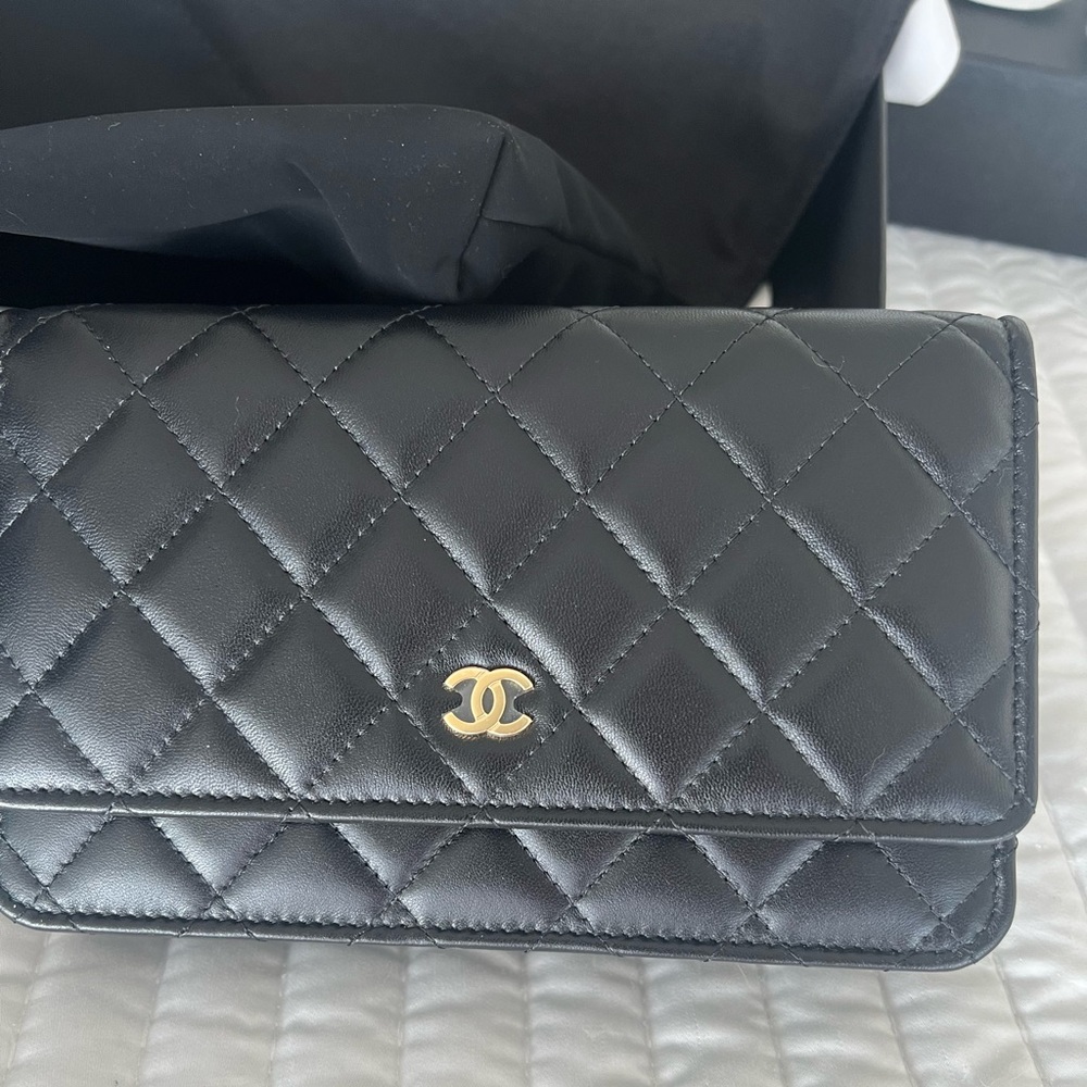 Black Chanel wallet on a chain